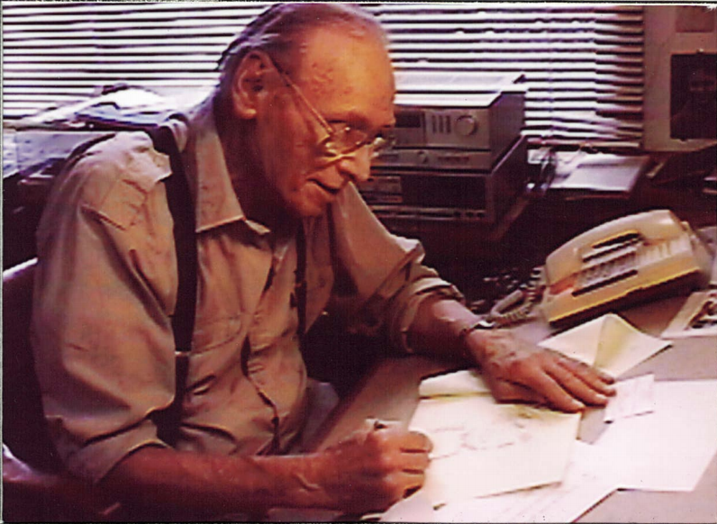 Cartoonist Ben Brown at his drawing desk, c. 1990s